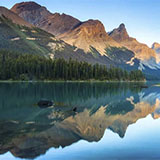 Mountains behind a glassy clear lake