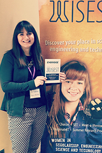 Nancy Manchak, P.Eng., stands in front of a WISEST banner.